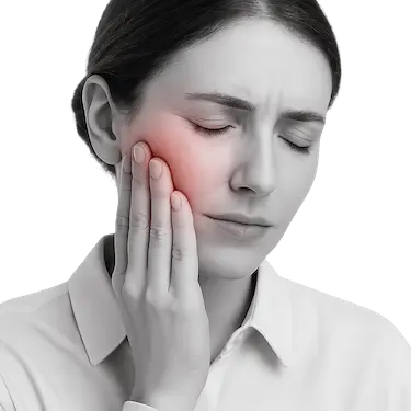 Mujer con dolor dental y encías inflamadas tocándose la mejilla en busca de alivio