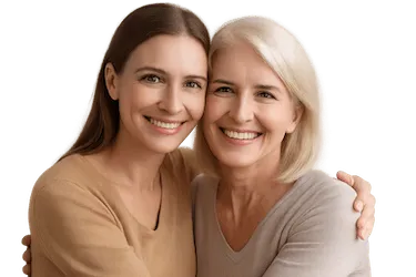 Madre e hija sonriendo que ilustran la predisposición genética a la periodontitis