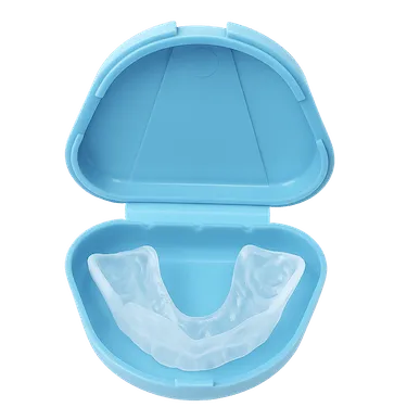 Férula de descarga transparente en estuche azul para tratar el bruxismo nocturno